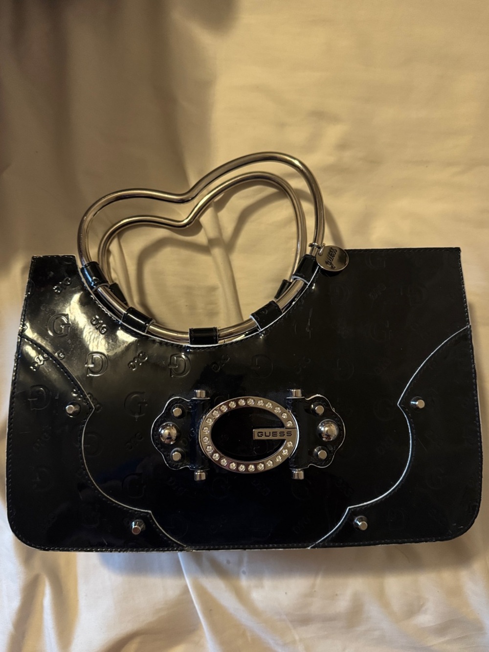 GUESS Black Patent Heart-Handle Clutch with Crystal Logo